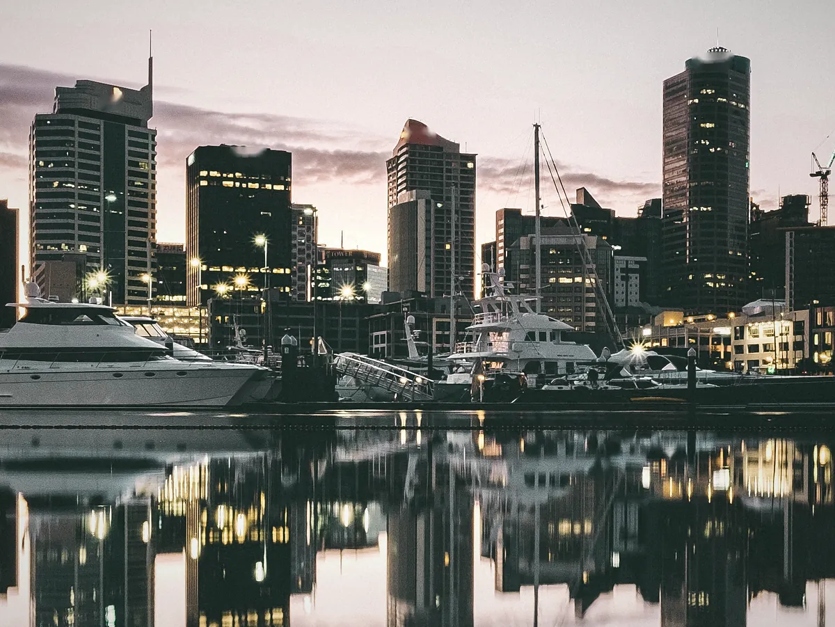 Office towers reflected in a harbour basin