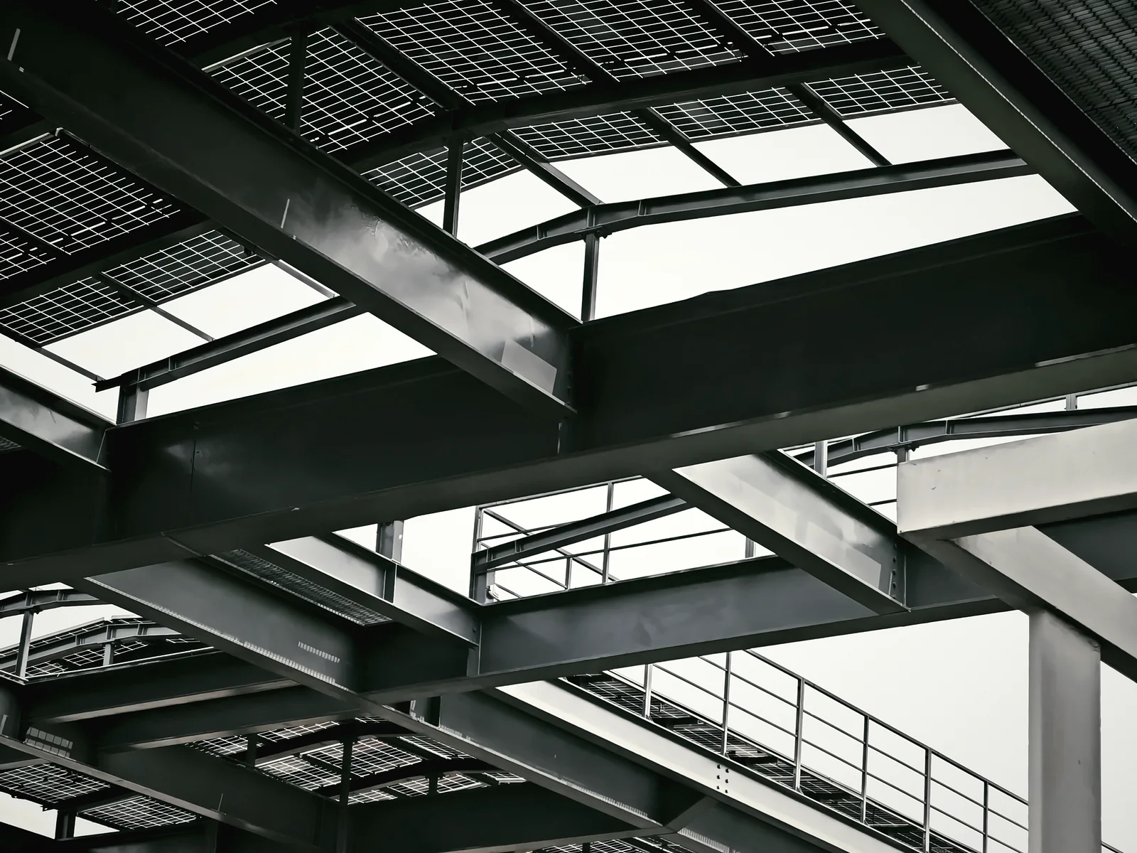 Steel frame and walkway beneath rooftop solar panels